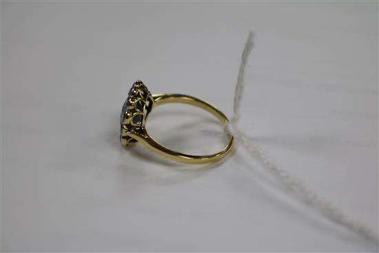 An 18ct gold, diamond and pale blue/green zircon set oval cluster ring, size P.